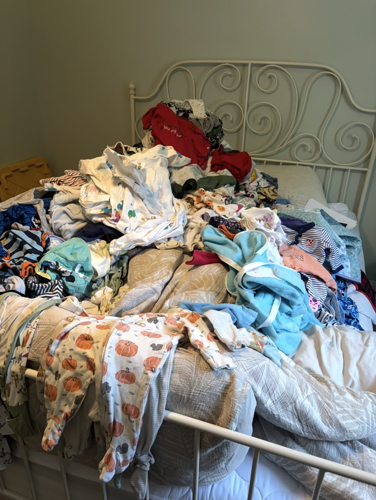 A second group of children’s clothing ready to be sorted by season and size